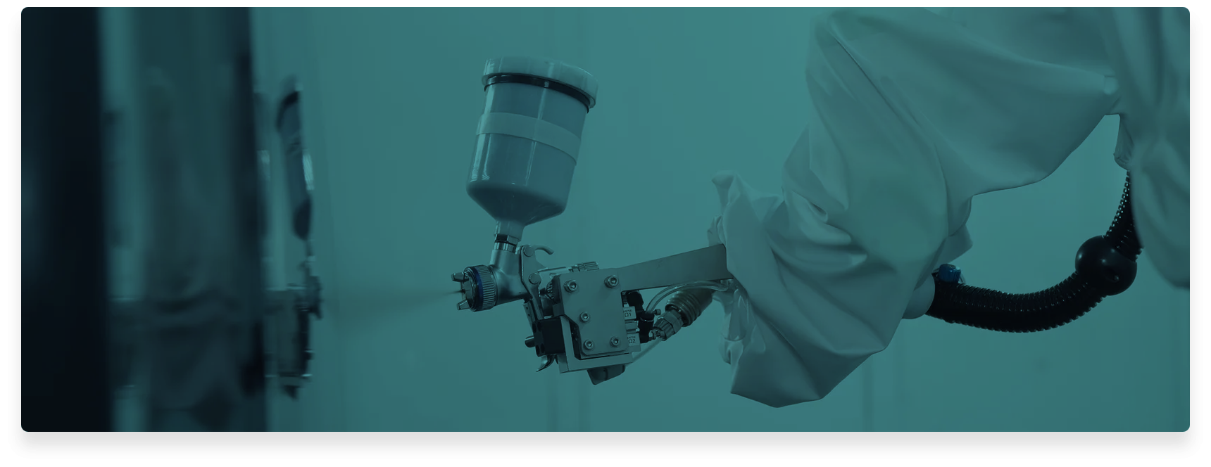 Technician operating an XTRITON PG-90E AI Spray Painting Robot with a tablet