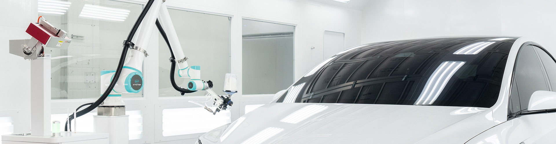 XTRITON PG-90E AI Spray Painting Robot at work in an automotive refinishing facility